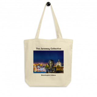 Tote Bag: The Captain Janeway Statue illuminated by downtown Bloomington, Indiana 